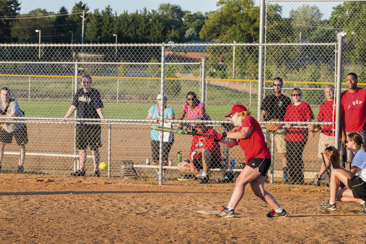 Woman hitting a softball