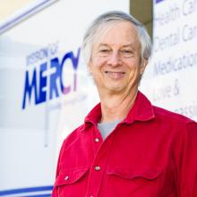Michael Dean, Pd.D., volunteering with Mission of Mercy as a Spanish language interpreter.