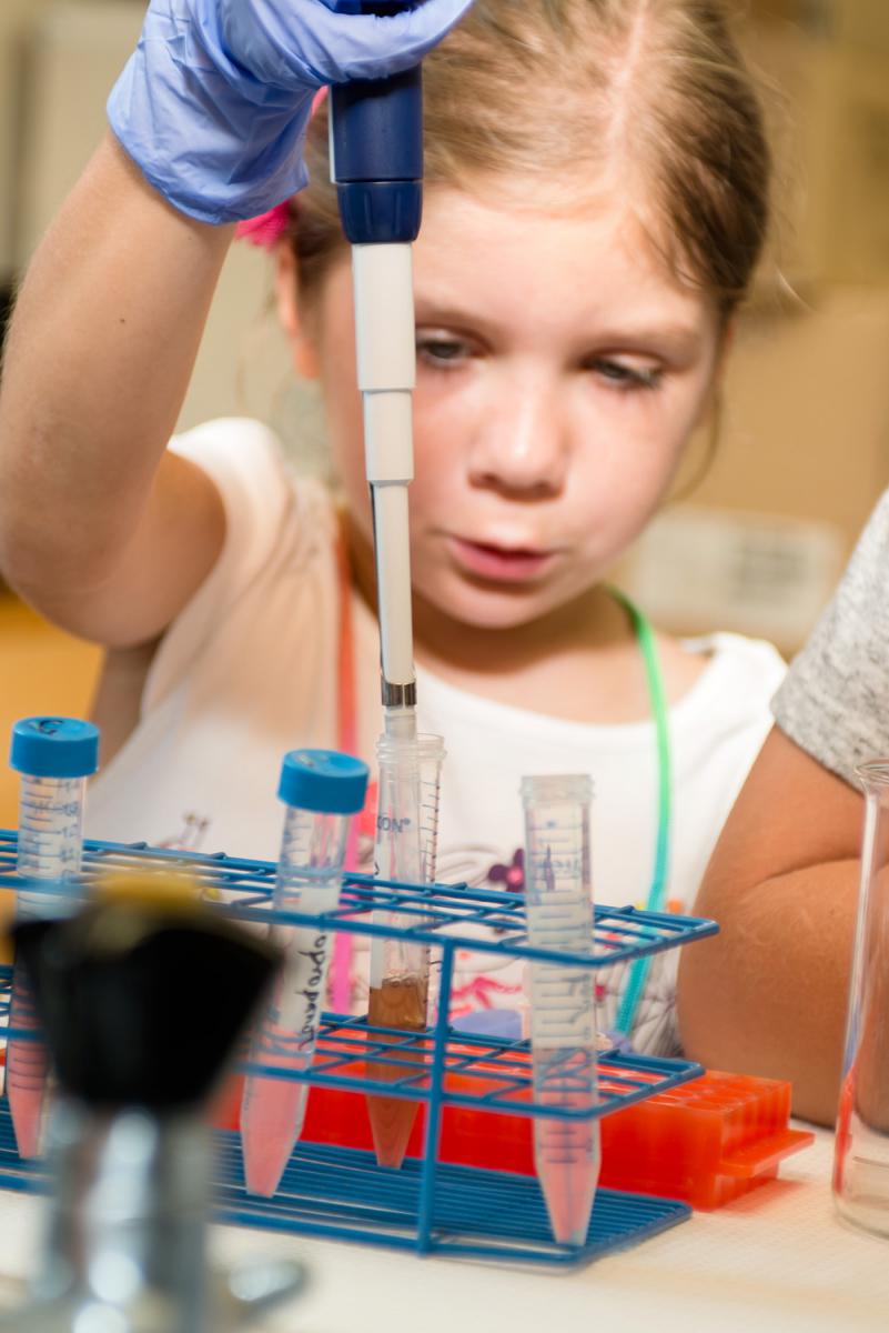 Girl using a pipette.