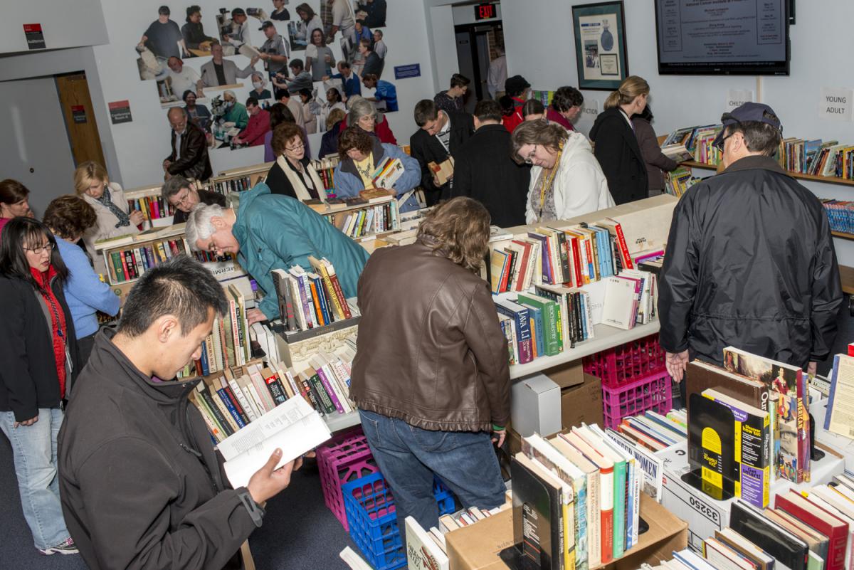 People looking through books