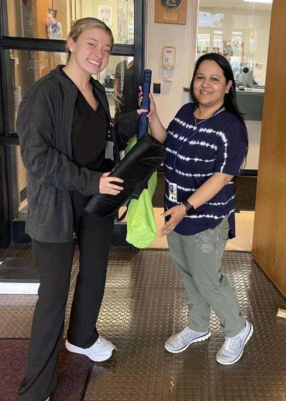 Raffle winner Swati Priya (right) poses with Taylor Johnson. (Photo by authors.)