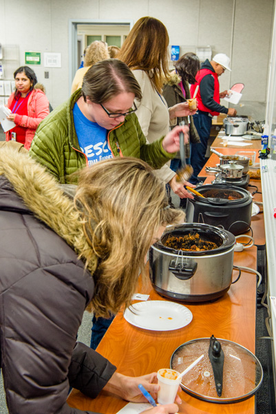 Visitors line up to try the chili…