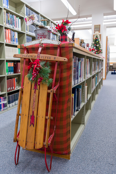 The Scientific Library’s “Woodland Holiday” blended modern and antique objects, like this sled, that one might take on a winter camping trip. (Photo by Samuel Lopez)