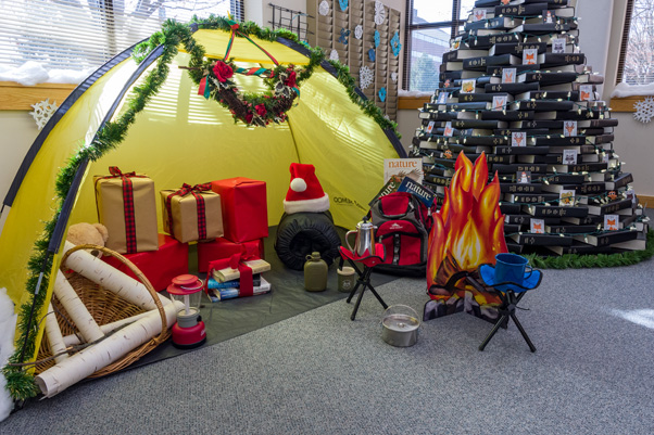 A cozy campsite and the book tree comprised the centerpiece of the Scientific Library’s theme. (Photo by Samuel Lopez)
