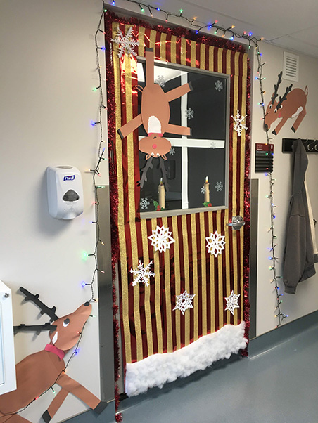 First-time competitors Melissa Kuehnert and Jasmine Loyal say their “Reindeer Games” door was inspired by a love for the holidays and a desire to creatively decorate their limited space. (Photo by Melissa Kuehnert)