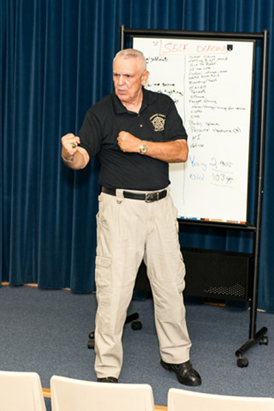 Kirby Maybush teaches a self-defense seminar at Environment, Health, and Safety Program’s open house May 19.