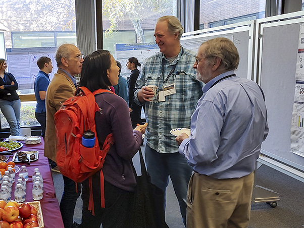 The poster display held midafternoon was especially lively, with attendees spilling out into the Building 549 atrium to discuss their research.