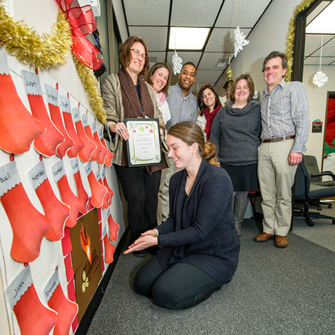 Participants in Building 427, second place winner, Building category, for “Holiday Fun.” Kneeling in front: Amber Elia; standing, from left: Laura Geil, Julie Hartman, Jim Cherry, Marsha Nelson-Duncan, Melissa Porter, and Paul Lyons. 