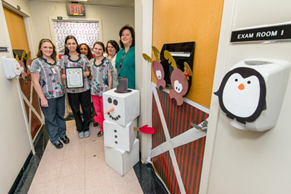 First place, Group category, was awarded to the staff of Occupational Health Services for “Reindeer Games.” From left: Jenna Seiss, Ariana Jones, Rose Saad, Esther Shafer, Margaret Slaughter, and Sarah Hooper. 