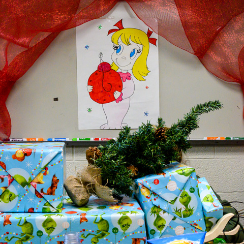 Cindy Lou Who looks from her window to see the Grinch’s sleigh piled with pilfered gifts in Building 571