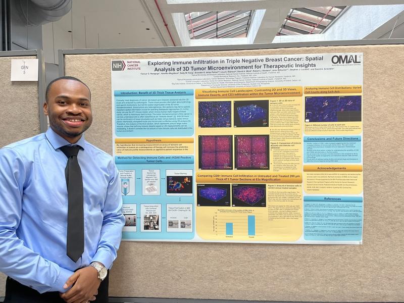 Favour Nwagugo, a postbaccalaureate research fellow in the NCI’s Optical Microscopy and Analysis Laboratory with Heinz, at the 2023 NIH Research Festival, presenting his poster, “Exploring Immune Infiltration in Triple Negative Breast Cancer: Spatial Analysis of 3D Tumor Microenvironment for Therapeutic Insights.” Image Credit: Favour Nwagugo