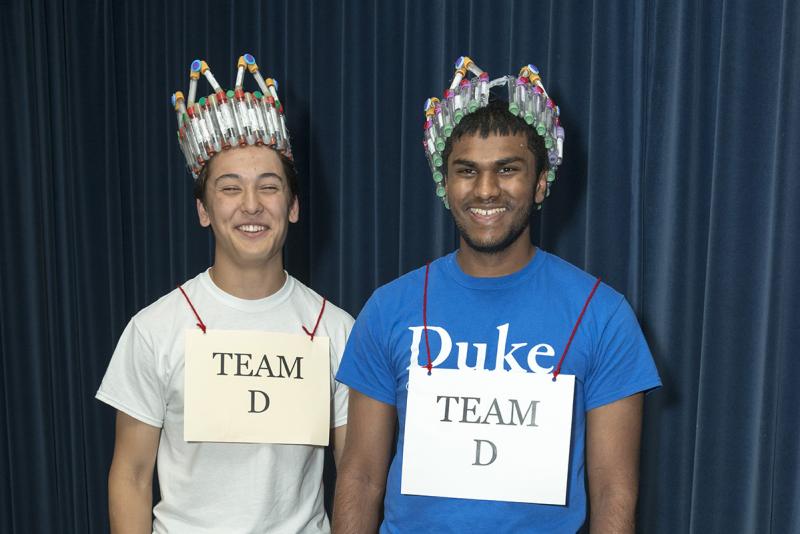Evan Yamaguchi and Anuk Dayaprema pose with their crowns. 