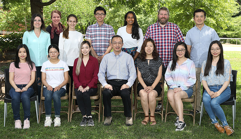 Mitchell Ho (front, center) with his lab team members. 
