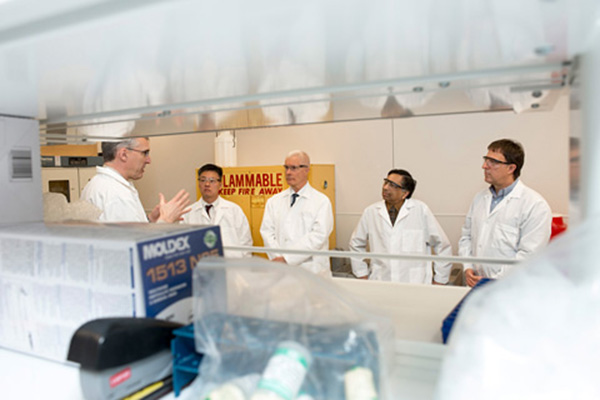 Scott McNeil (left) leads a VIP tour of NCL laboratories for the White House’s Nanoscale Science, Engineering, and Technology subcommittee leadership (from left to right): Jim Kim, toxicologist, Office of Management and Budget; Robert Pohanka, retired director, National Nanotechnology Coordination Office; Altaf Carim, assistant director, Research Infrastructure, Office of Science and Technology Policy (OSTP); and Lloyd Whitman, assistant director, Nanotechnology, OSTP. File photo.