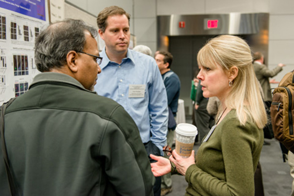 Deborah Morrison, Ph.D, chief, Laboratory of Cell and Developmental Signaling, discusses her research at one of the poster sessions. 