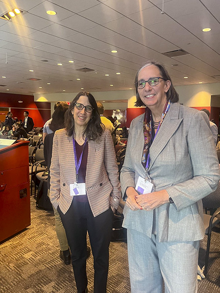 NCI Director W. Kimryn Rathmell (right), here with University of Toronto's Meredith Irwin, gave opening remarks at the RAS Symposium.