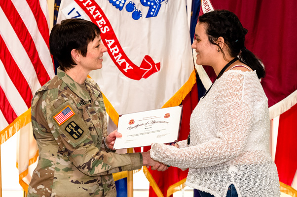 Maj. Gen. Barbara Holcomb (left) closed out the festival by presenting awards to outstanding participants.