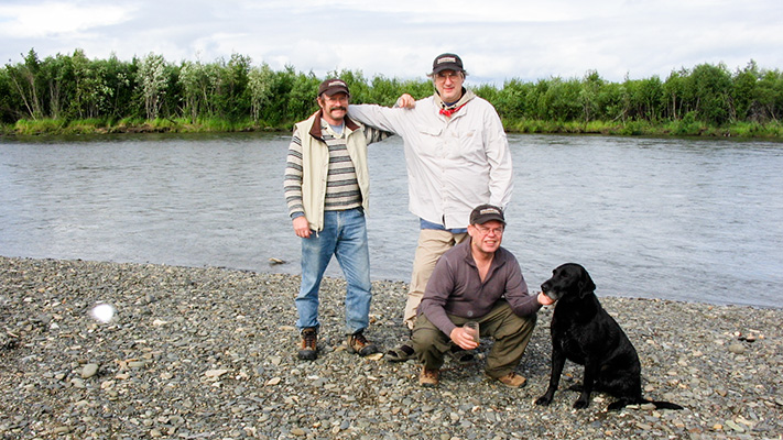 Jeffrey Strathern (left) with Stephen Hughes, Doug Whittington (kneeling), and Nolan (dog) on the bank of the Kisaralik River in Alaska in 2007.