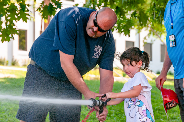 Fort Detrick Fire and Emergency Services was on hand to let children test their mettle as firefighters by putting out a simulated fire with an actual hose.