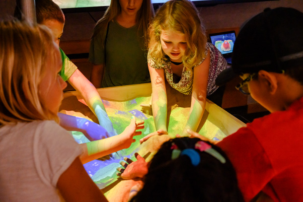 More than just play: by digging around in the Interactive Natural Hazards Sandbox, children could see how topography affects flooding and snowfall.