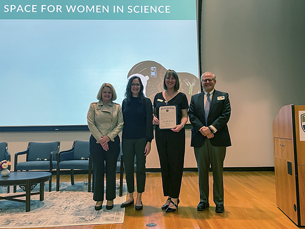 Frederick County Executive Jessica Fitzwater (second from left) proclaimed an observance of Women and Girls in Science Day in Frederick County. Here, she’s joined by leaders from the host institutions: Andrea Chapdelaine (left), president of Hood College; Ashley Waters (second from right), executive director of Woman to Woman Mentoring, Inc.; and Ethan Dmitrovsky (far right), president of Leidos Biomedical Research, Inc., and laboratory director of Frederick National Laboratory. (Photo by Mary Ellen Hackett