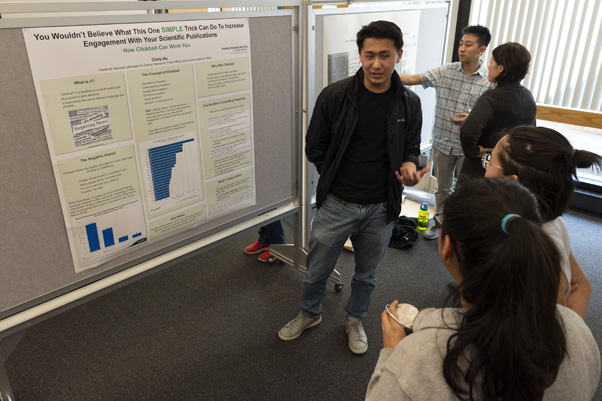 Chris Hu (center) said the poster session was “pretty relaxing” after he sidelined his anxiety. By the end of the event, he was confidently explaining his project, an assessment of clickbait-style headlines and principles for writing scientific headlines.
