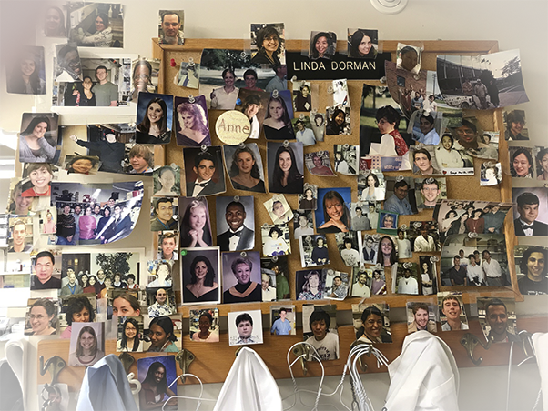 Young’s laboratory maintains a gallery of past trainees and interns. (Photo contributed by Howard Young)