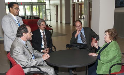 A group of people sitting around a table.