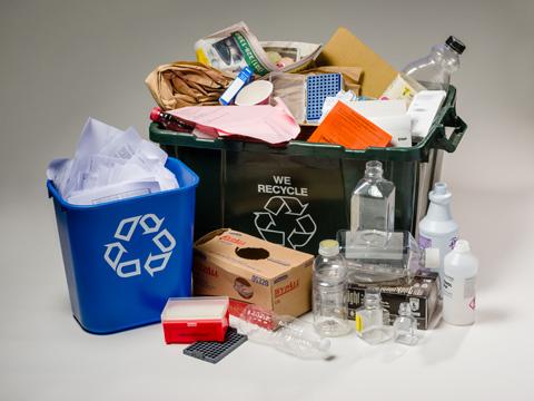 Photo of single-stream recycling bins and items.