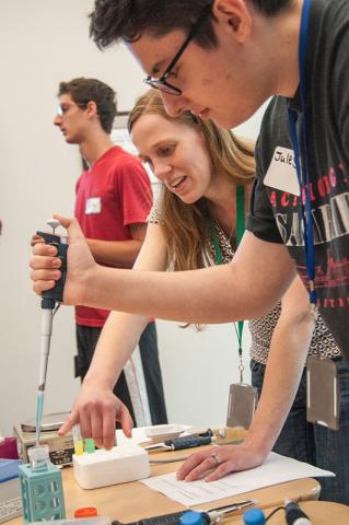 Students using  pipettes.