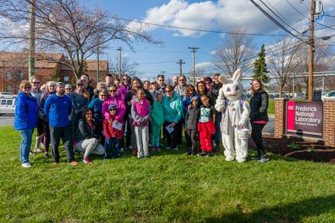 The Bunny Hop 4k participants gathered for a group photo with the Easter Bunny. 