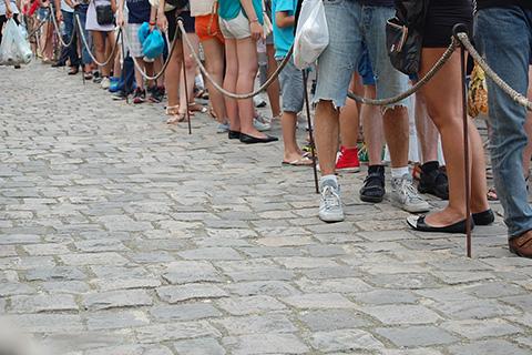 Photo of people standing in line