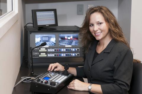 Woman at monitors.