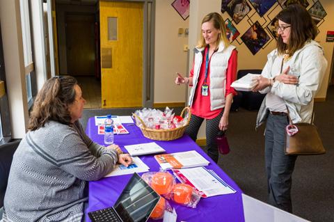 Photo of OHS nurse and visitors at the event