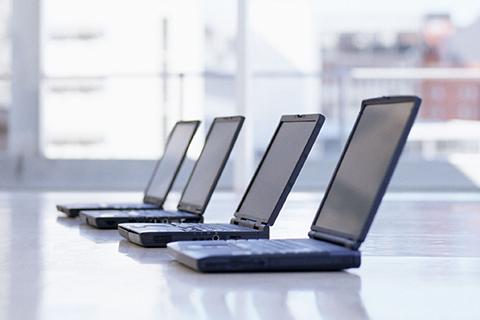 Laptops sitting on a table.