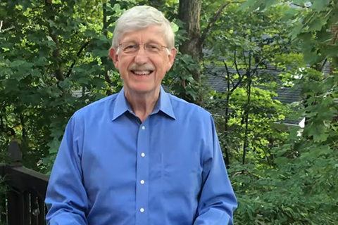 Photo of NIH Director Francis Collins speaking on his deck. A group of trees is in the background.