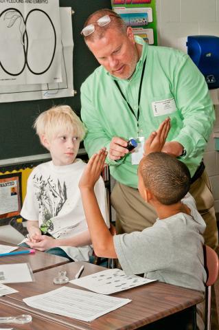 Gary Krauss working with elementary school students
