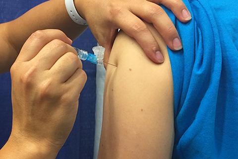 A close-up of a vaccine being administered