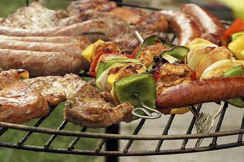 Meat and vegetables on the grill.
