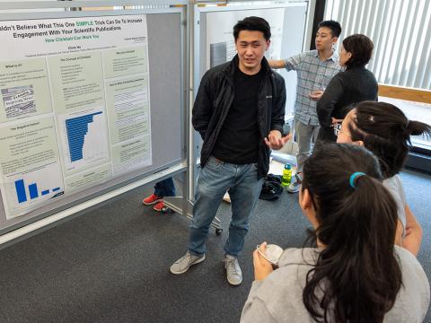 WHK Student Intern Chris Hu presents a scientific poster