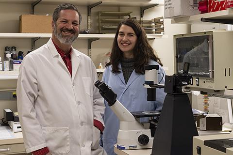 Dr. Dennis Klinman stands with Begum Horuluoglu in their NCI at Frederick laboratory