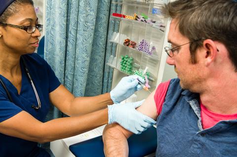 Guy getting flu shot.