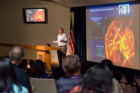 Speaker presenting to an audience.