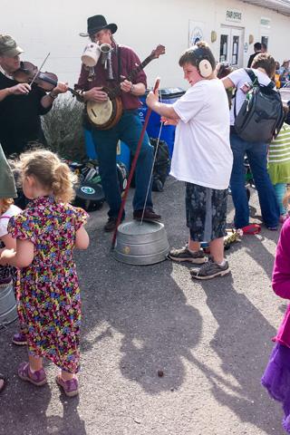 Banjo player surrounded by children