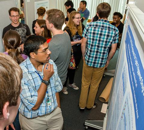 People viewing scientific posters.