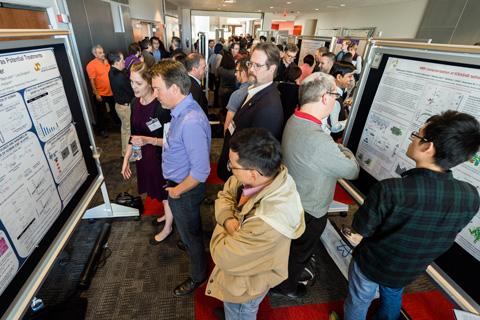 People viewing posters.