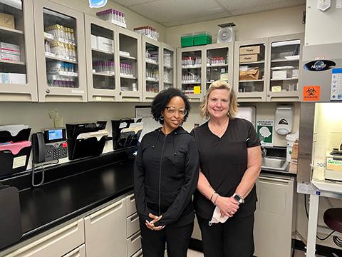 Nurses Celeste Lashley and Kelly Jo Lockard-Toms in an exam room