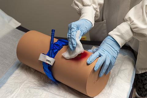 Photo of Tissue demonstrating tourniquets and wound-packing
