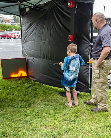 Photo of Raylin Payne completing the R.A.C.E. emergency notification simulator