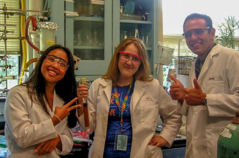 Three student interns in the lab.